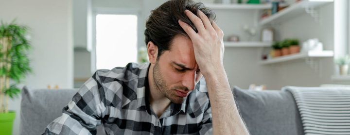 Man experiencing a painful headache