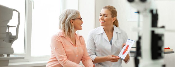 Elderly woman speaks with eye doctor