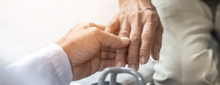 Doctor inspecting patient's hand