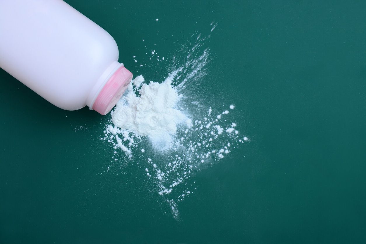 Talcum powder spilling out of bottle