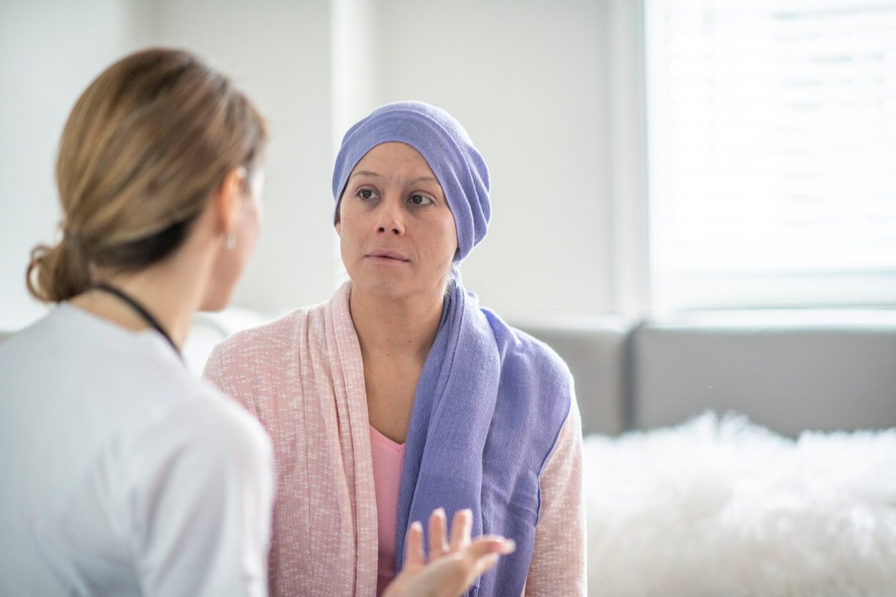 Cancer patient talking to caretaker