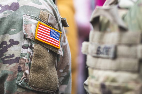 US flag on camouflage shirt