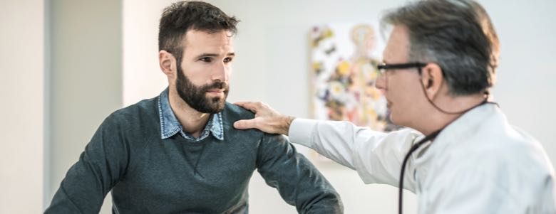 Younger male consulting a doctor