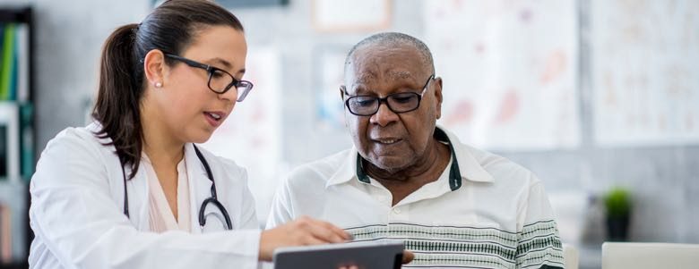 elderly man consulting a doctor