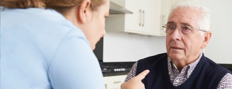 nurse yelling at a senior citizen