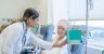 Caucasian senior woman receiving chemotherapy treatment at the hospital