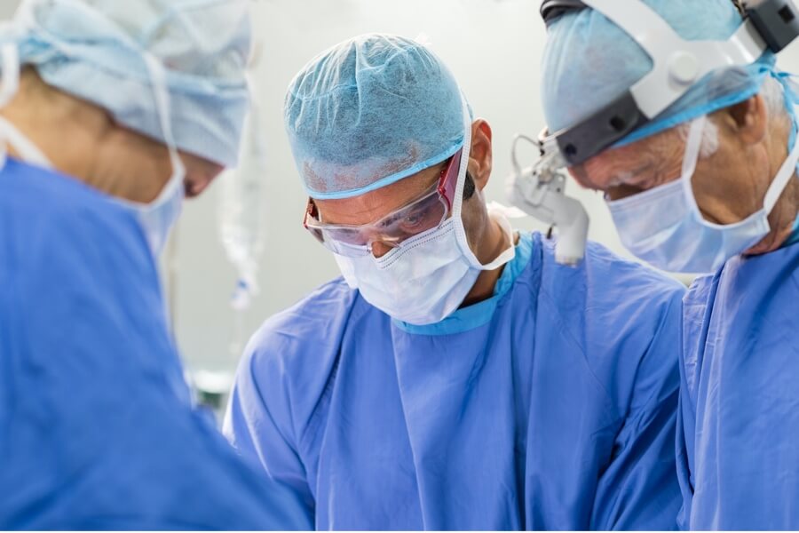 Doctors completing surgical procedure