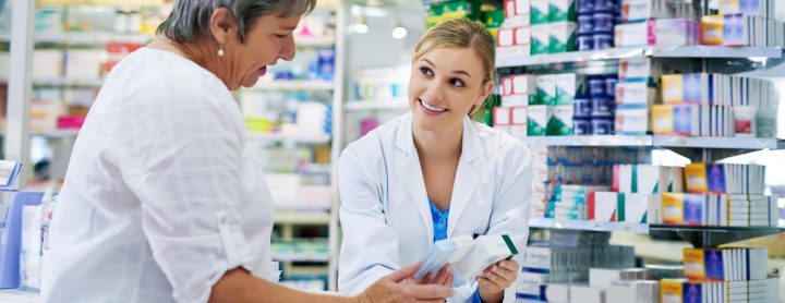 Pharmacist advises customer on prescription