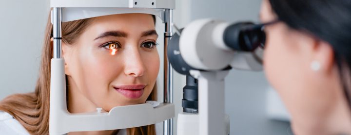 Woman receiving eye exam from doctor