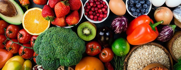 A variety of fruits and vegetables laid out on a table