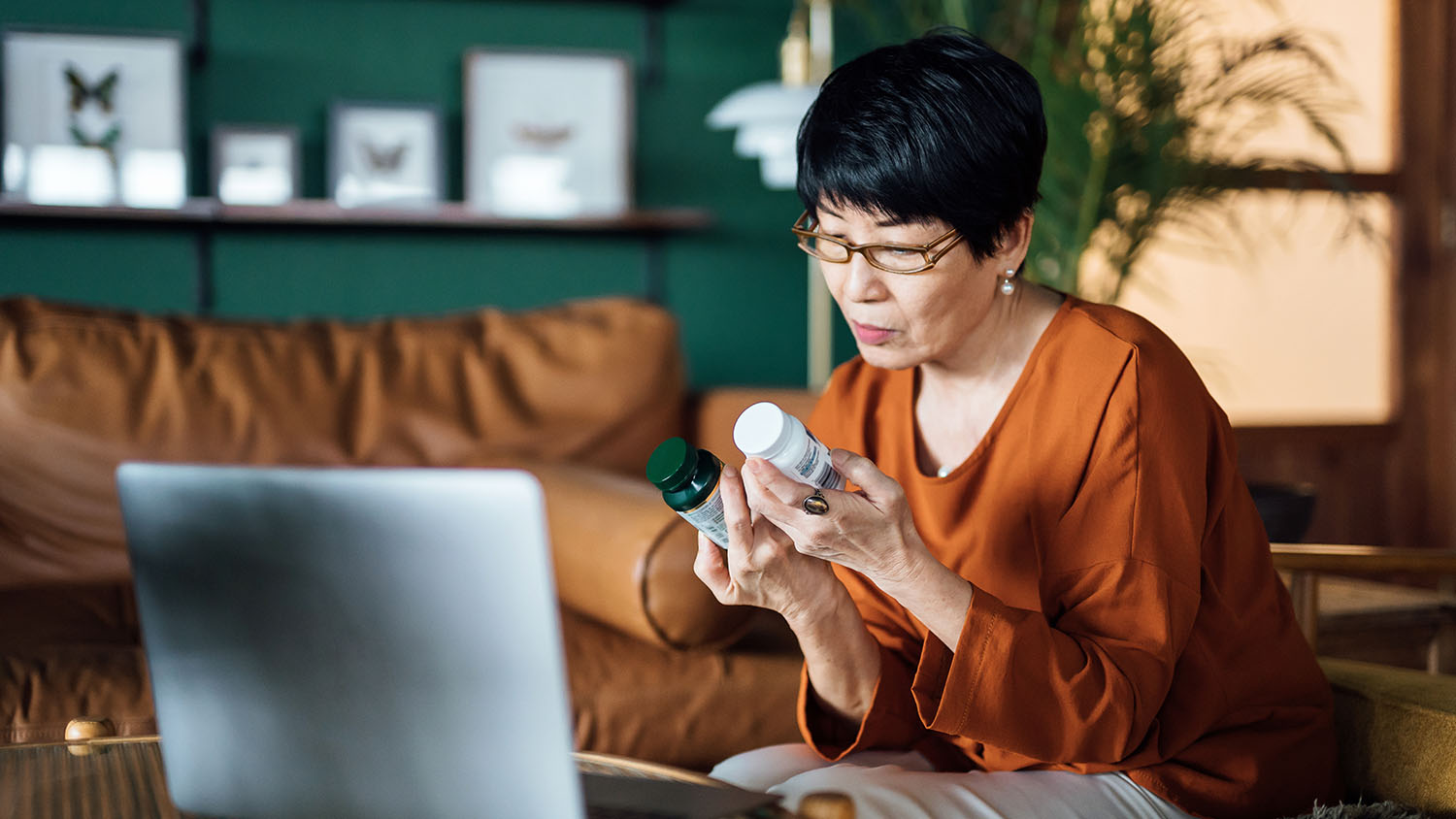 Woman comparing medication containers