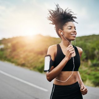 Woman exercising while running outside